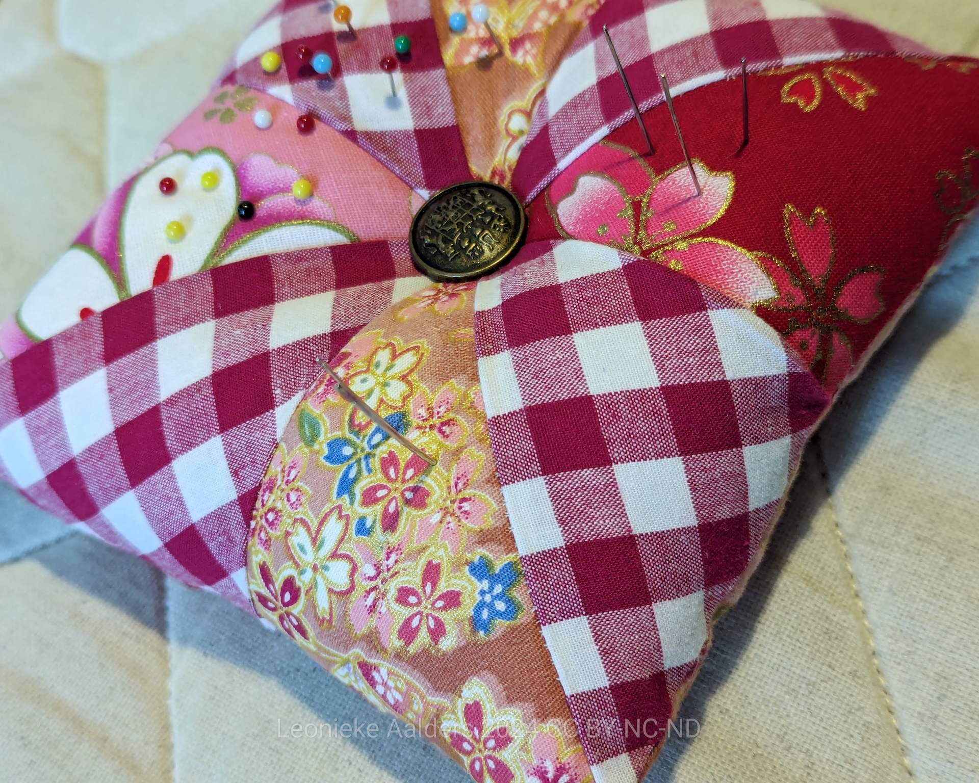 cover: patchwork pincushion